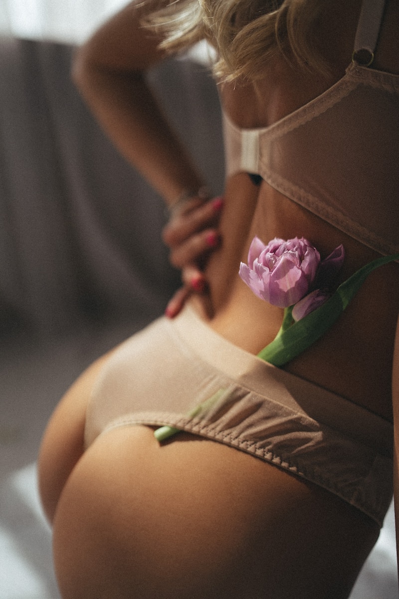 a woman with a flower on her stomach