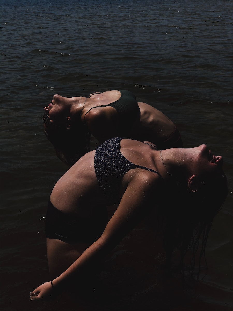 woman in black bikini bottom on water