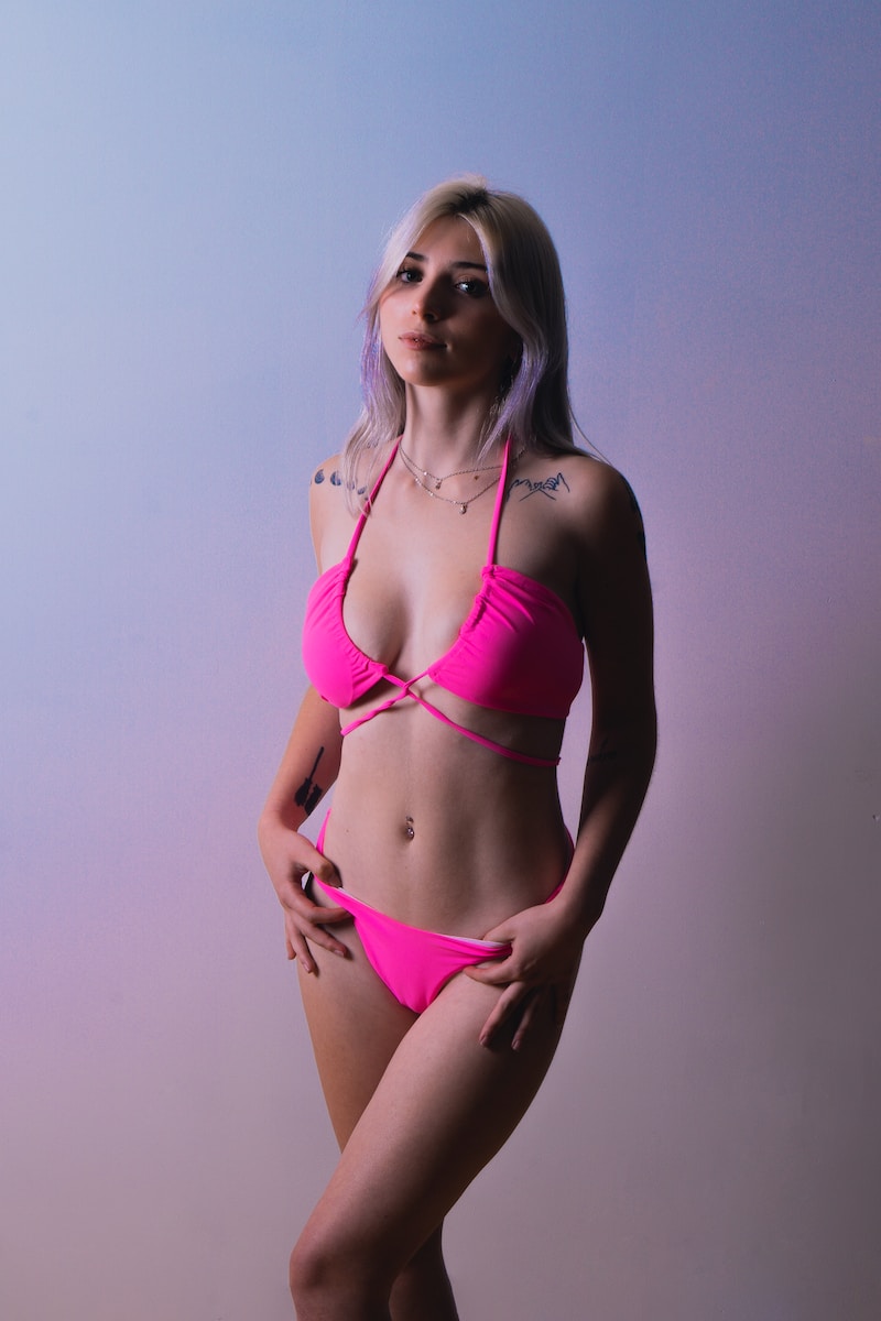 woman in pink bikini posing for photo