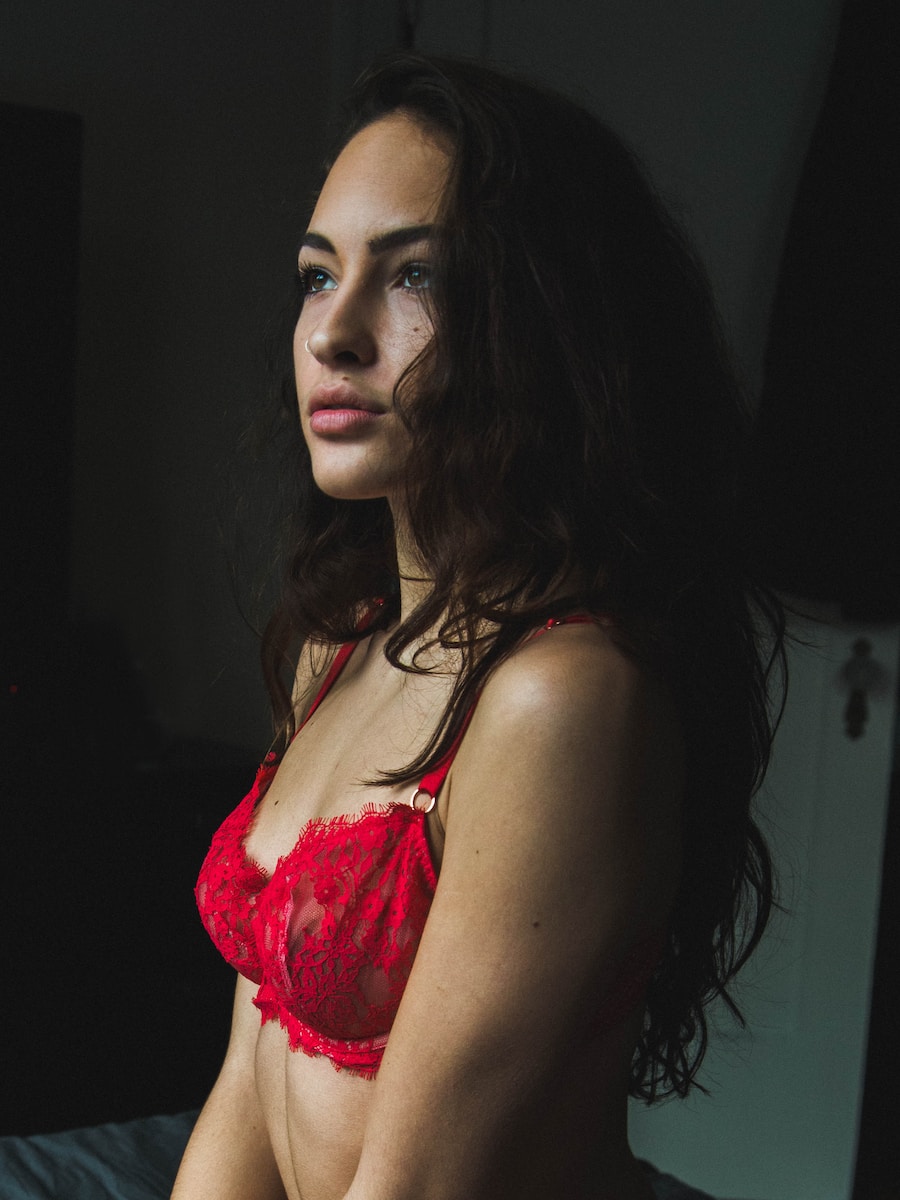 woman in red floral brassiere