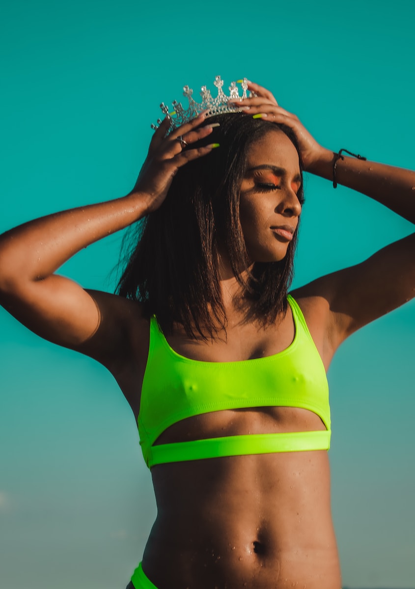 woman in green and yellow sports bra