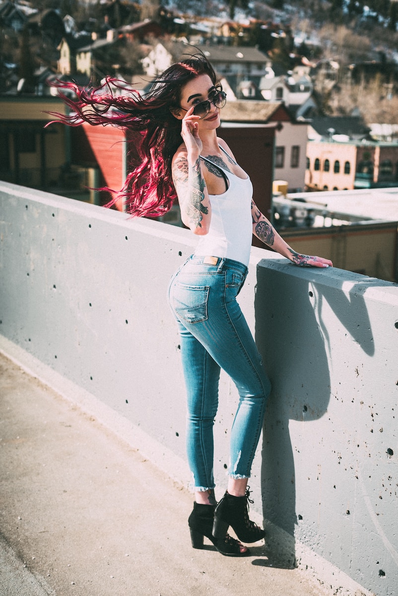 woman standing near concrete rails