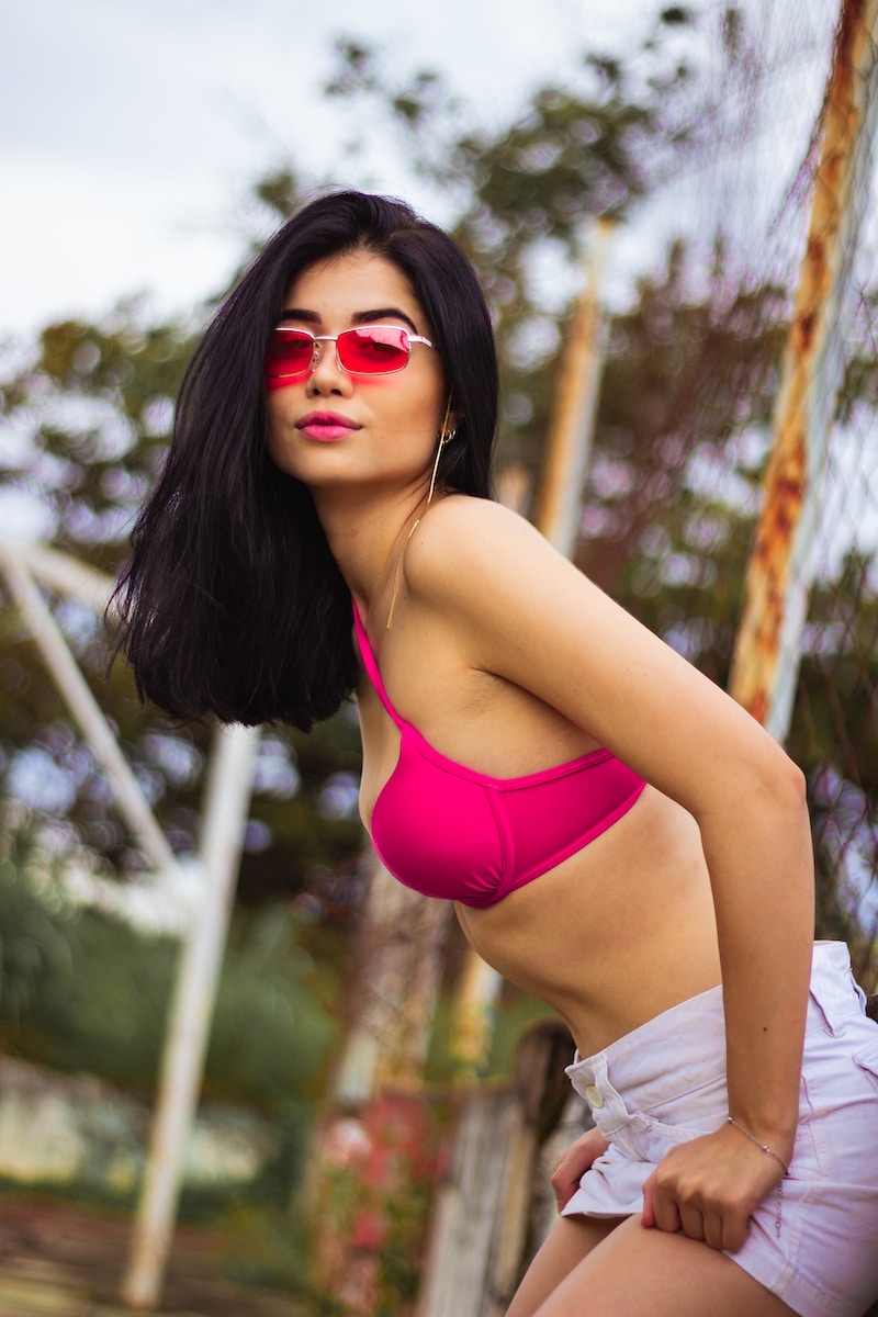 woman in pink bikini wearing sunglasses