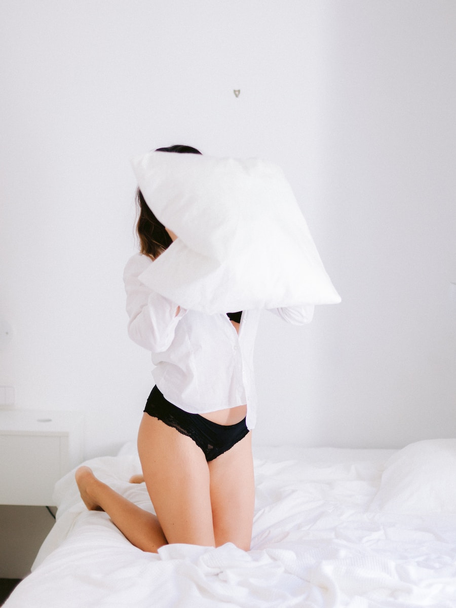 woman wearing white long-sleeved shirt and black panty