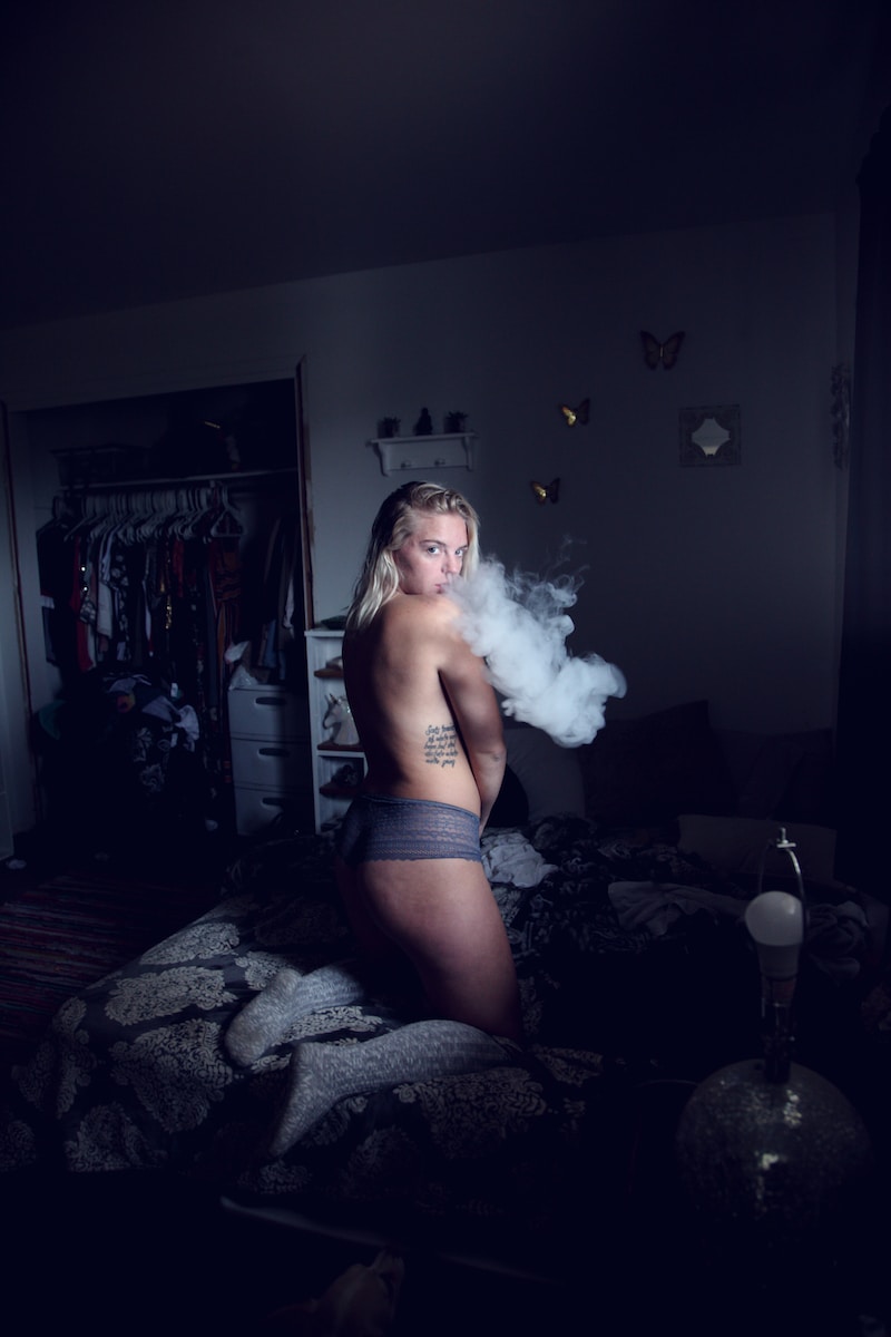 woman doing smoke in room
